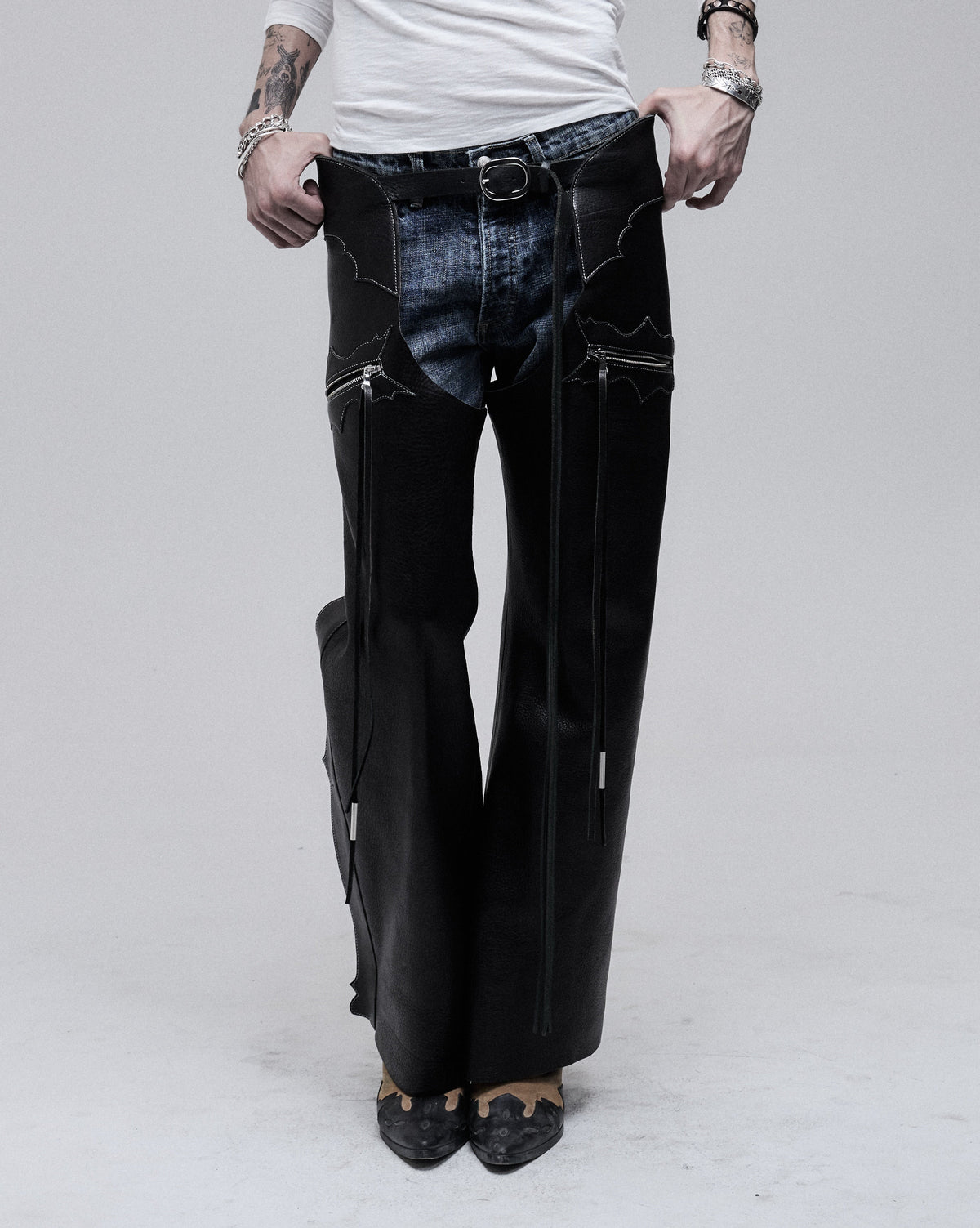 Riding Chaps in black leather, front view on model