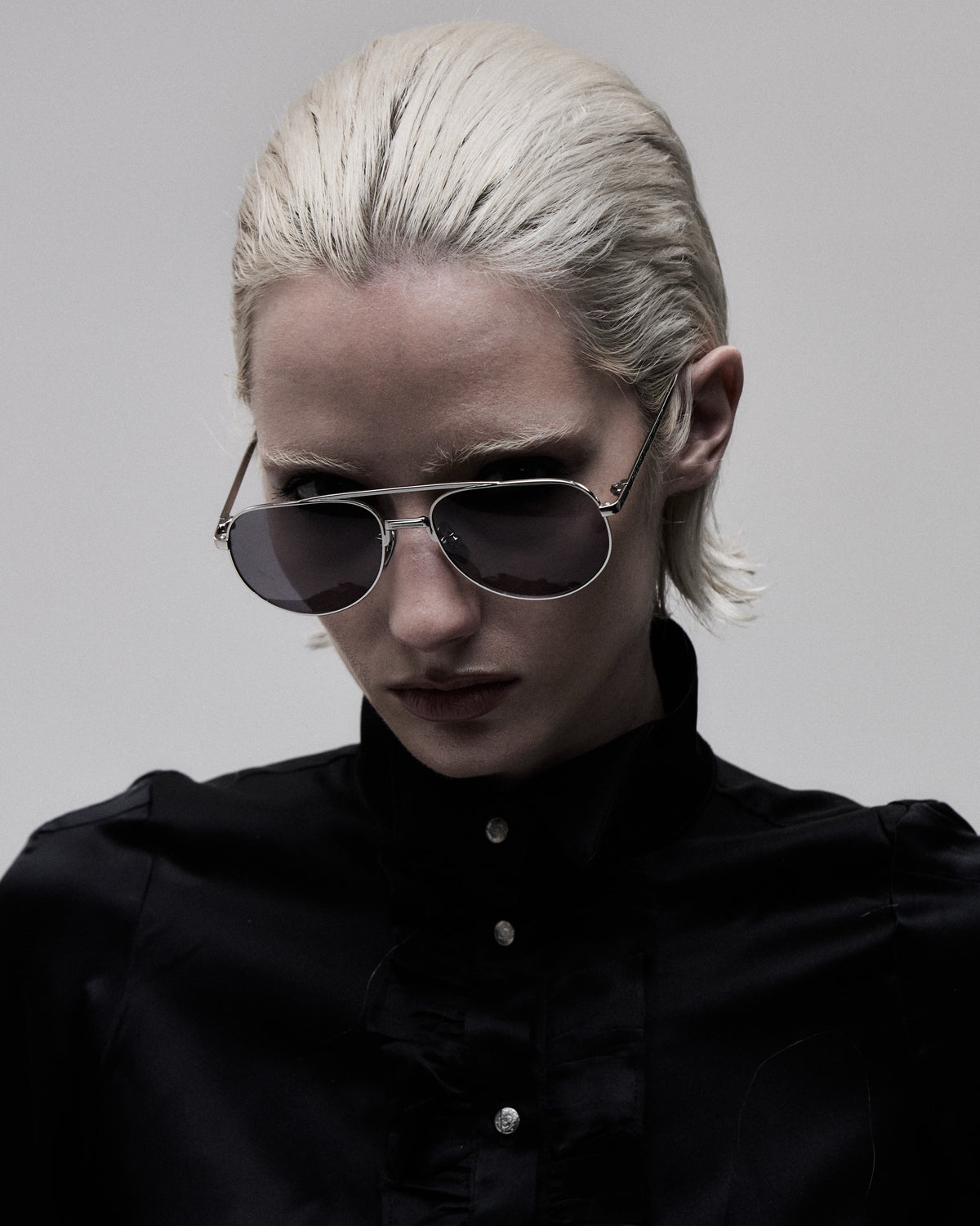 Aviator 001 sunglasses, close-up on model