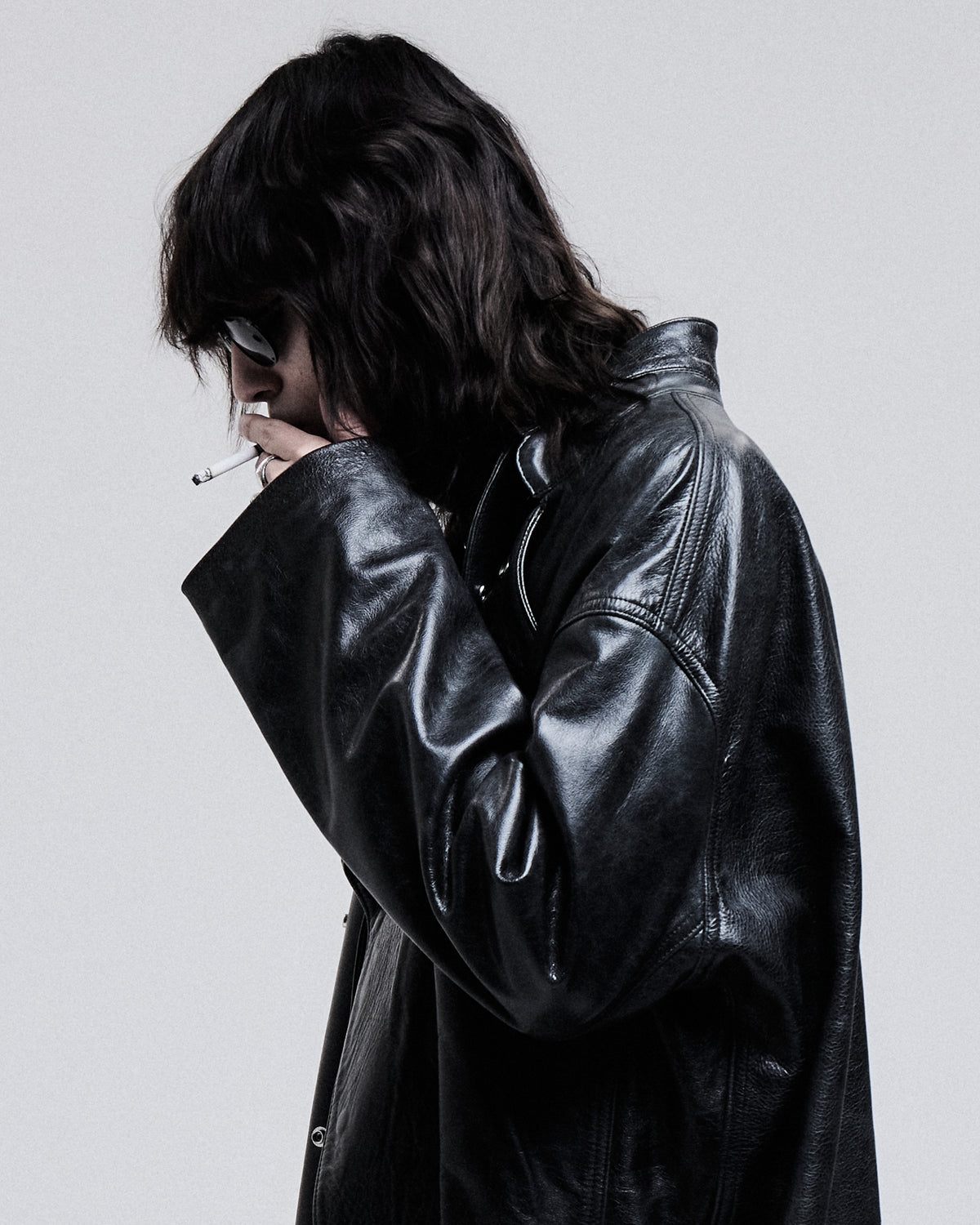 Jeffrey Coat in black, close-up of the leather and lapel on model