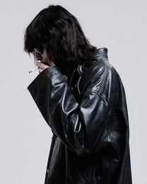 Jeffrey Coat in black, close-up of the leather and lapel on model