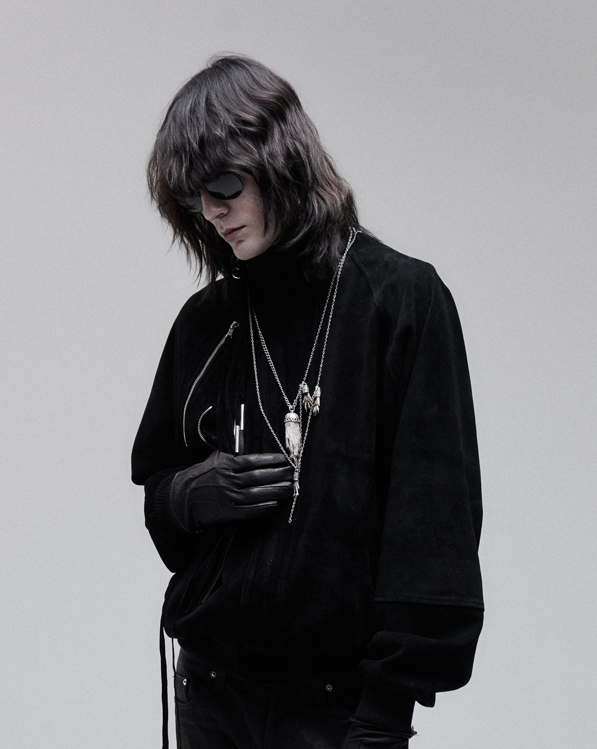 Suede Bomber jacket in black, three-quarter view on model