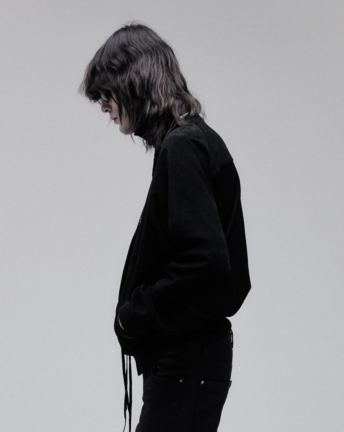 Suede Bomber jacket in black, side view on model