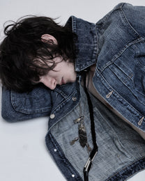 Hollywood Denim Jacket in washed blue, close-up of the collar on a reclining model