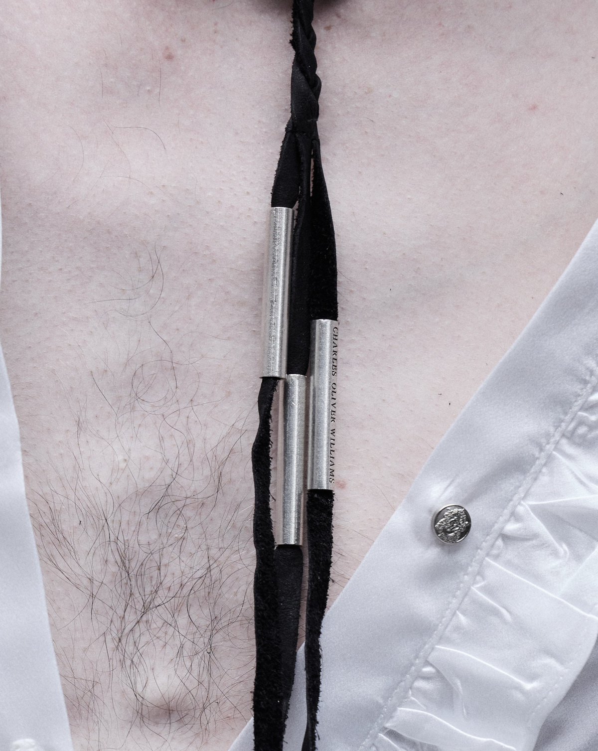 Tassel necklace, close-up of the silver tips